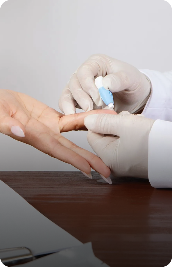 Healthcare professional performing fingerstick blood collection for rapid HIV test on patient