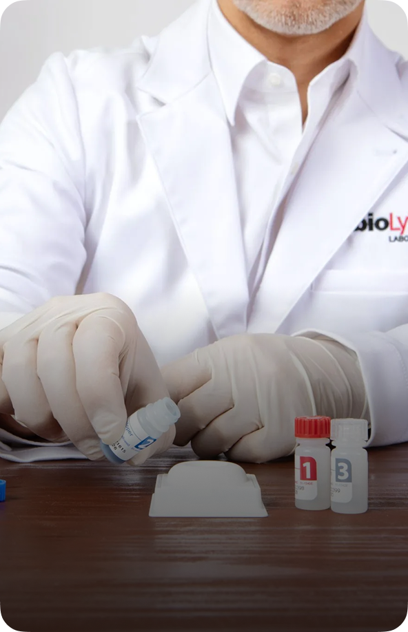 Healthcare professional in gloves pouring reagent bottle into INSTI HIV rapid test device